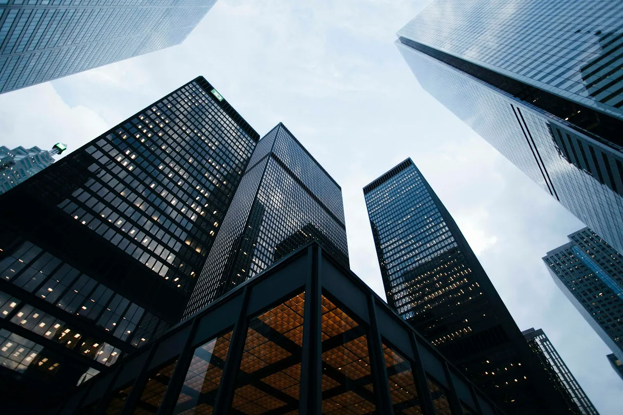 An upward perspective between contemporary glass towers